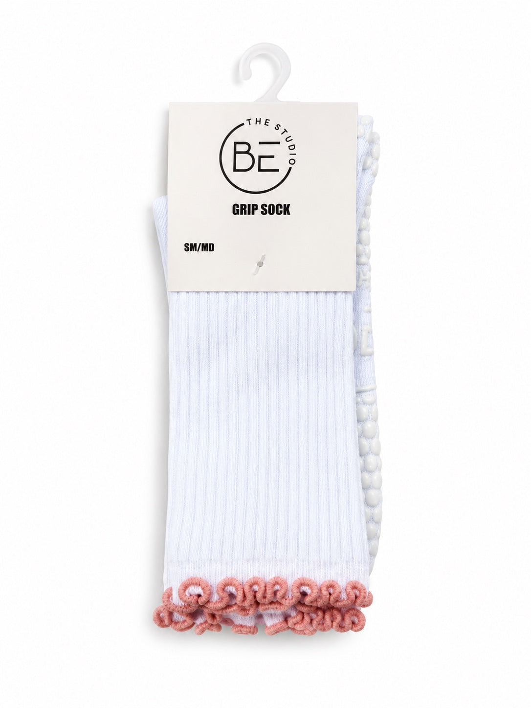 White grip socks with coral ruffle trim