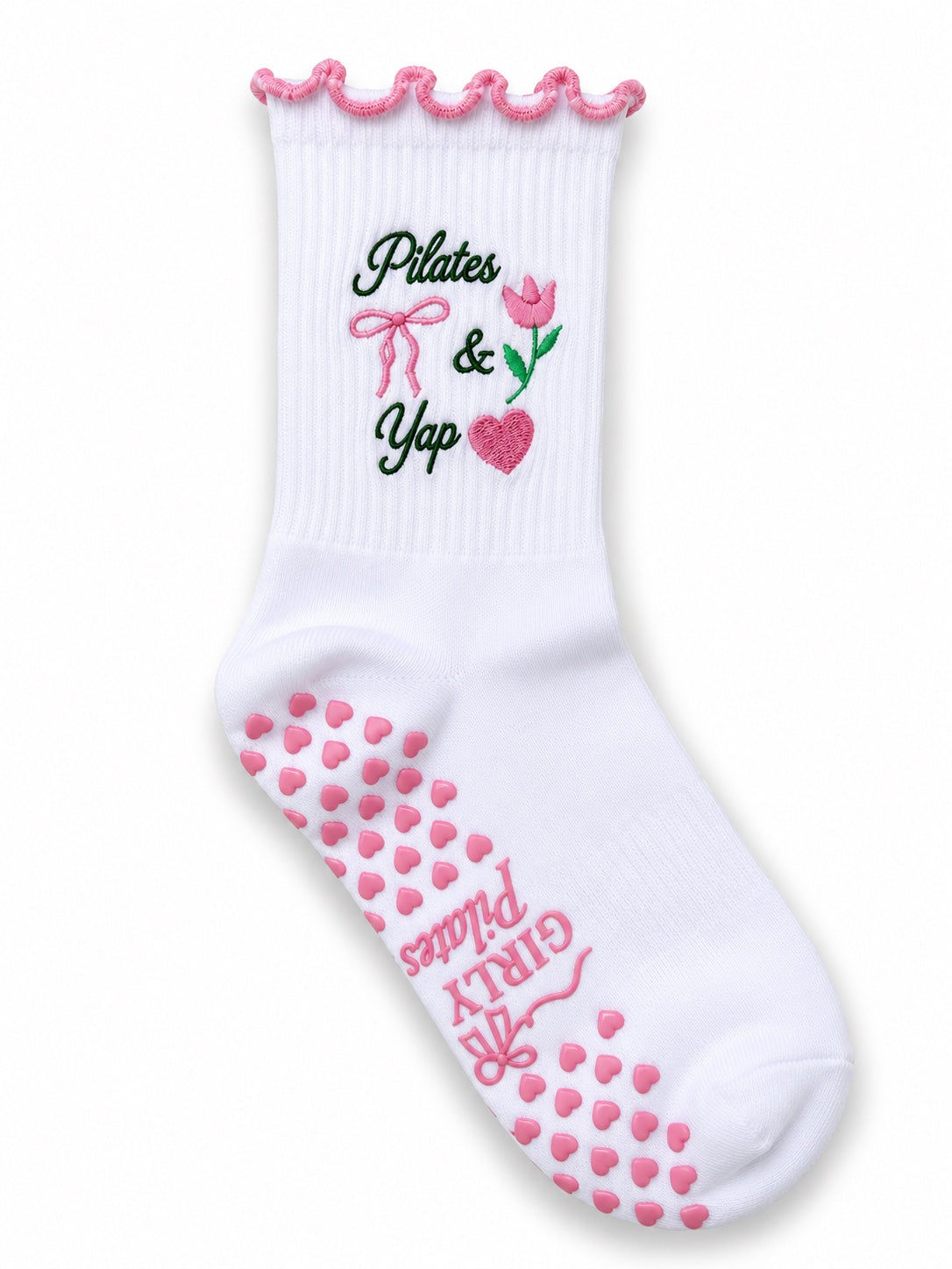 White Pilates and Yap grip socks with pink ruffle cuff and pink heart grips